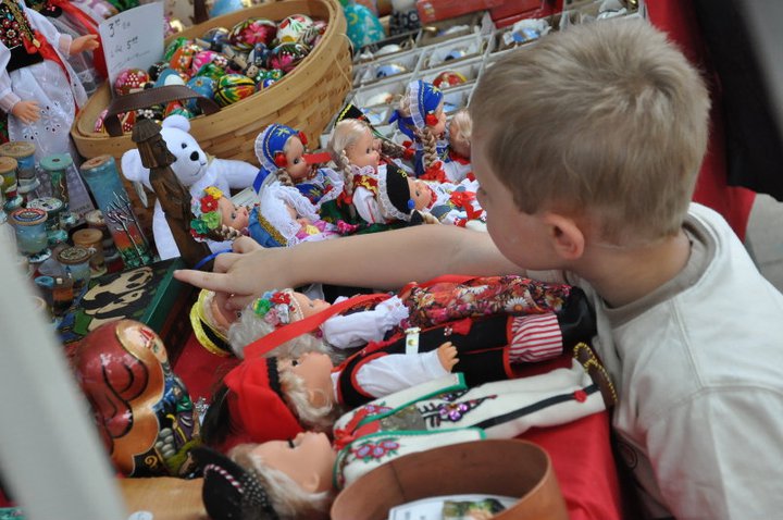 Young boy looking at traditional dolls at the Simply Slavic Festival